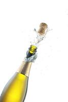 Opening a bottle of champagne on a white background photo
