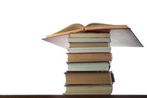 Stack of Books on the table with isolated background photo