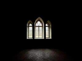 Dark room with backlight from large windows photo