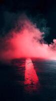 Red-Illuminated Asphalt Roadway with Smoke photo