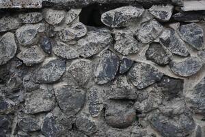Rough stone wall texture, outdoor, weathered, background, design photo