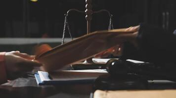 A person holding a piece of paper in front of a judge video