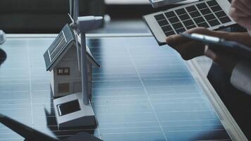 A person is using a calculator to calculate the cost of solar panels video