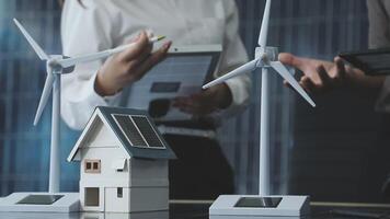 Wind turbines and solar panels on a table video