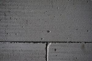 Grey concrete blocks wall texture background photo