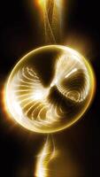 The golden-silver sphere is filled with a moving plasma structure that carries something alive and fantastic within it. video