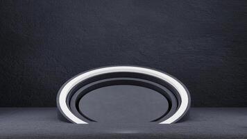 A circular light is sitting on a black surface photo