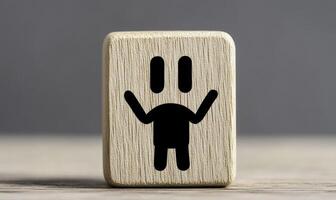 Wooden block with a simplistic smiley character design, conveying joy and positivity in a minimalistic style, perfect for playful and cheerful concepts photo