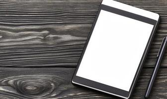 Blank digital tablet with stylus on rustic wooden background for design mockups, presentations, and creative brainstorming activities photo