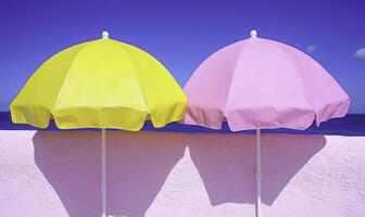 Two colorful umbrellas sit on a wall near the ocean photo