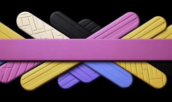 A group of colorful plastic sticks on a black background photo