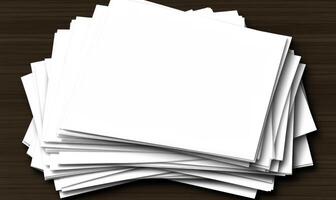 A stack of blank paper on a wooden table photo