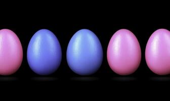 A row of four pink and blue eggs photo