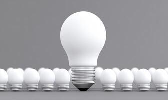 A light bulb is standing out from a group of white bulbs photo