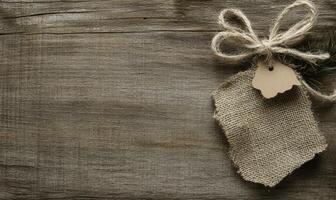 A tag with a tag hanging from a piece of burlock photo