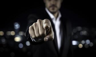 A man in a suit pointing at something photo
