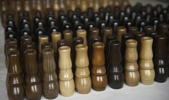 A Close-Up View of Colorful Wooden Pegs in Various Shades Arranged Neatly for Crafting and DIY Projects Showcasing Different Textures and Finishes photo