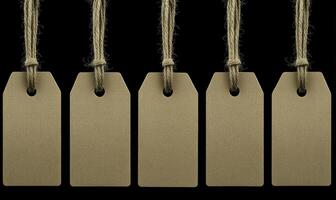 Blank Brown Tags with Twine Strings on Black Background for Crafting, Labeling, and Gift Giving, Ideal for Personalization or Branding Use photo