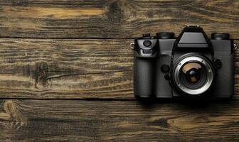 Vintage camera placed on rustic wooden surface with natural textures and warm tones, capturing the essence of photography and creative artistry photo