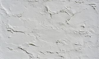 Textured white wall surface with subtle imperfections and uneven patterns for background design and artistic projects in modern spaces and applications photo