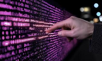 Hand Interacting with Digital Data Display at Night, Illuminated Binary Code in Pink Light, Modern Technology Concept, Information Interaction photo
