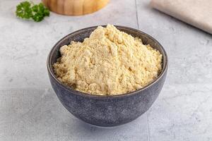 A bowl of ground chicken in a gray bowl photo