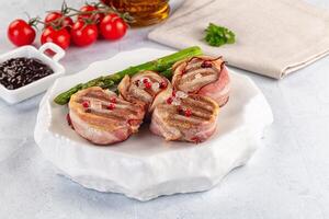 Bacon wrapped asparagus with bacon and tomato photo
