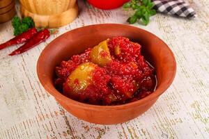 A bowl of red sauce with tomatoes and spices photo