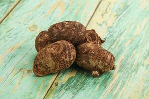 Coconut shell on a wooden table photo