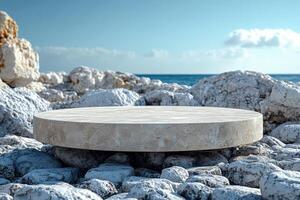 Stone circular platform on rocky beach by the sea. Summer day photo