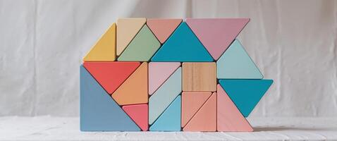 A colorful wooden block with triangles on it photo