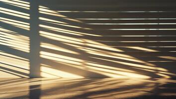 Sunlight casting diagonal shadows on dark floor through window blinds photo
