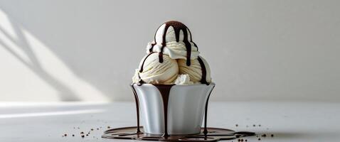 Ice cream with chocolate drips on white table photo