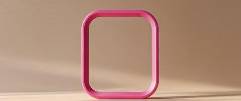 Pink rounded rectangle frame on tan surface backdrop photo