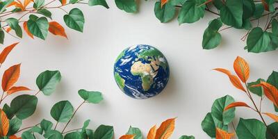 A planet earth model with green and orange colorful foliage. photo