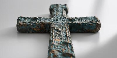 A cross made of old paint is on a table photo