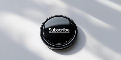 Subscribe button on white surface photo
