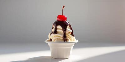 Vanilla Ice Cream Sundae with Chocolate Sauce and Cherry Topping photo