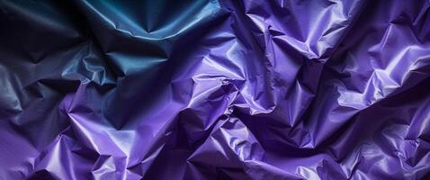 Abstract Purple Crumpled Paper on Dark Background photo