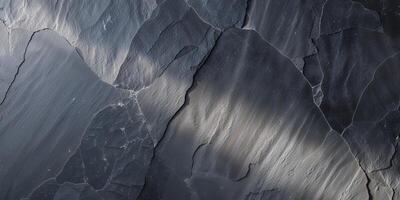 Dark Gray Slate Texture with Natural Striations and Subtle Light. photo