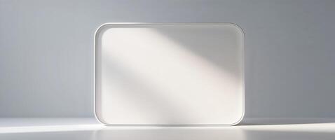 A white rectangular shape appears with soft rounded corners and shadows photo