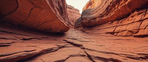 Orange sandstone rock face with natural cracks and layered texture photo