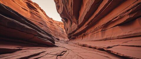 Orange sandstone rock face with natural cracks and layered texture. photo