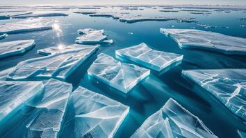 Icy landscape under bright sun showing mix of cracked ice and open water with orbital view photo