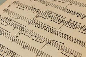 03.25.25 Lviv Ukraine Detailed sheet music displayed on a textured surface photo
