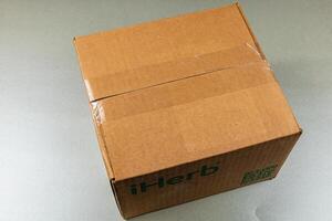 Lviv Ukraine 10.04.25 Package delivery of health products from iHerb photo
