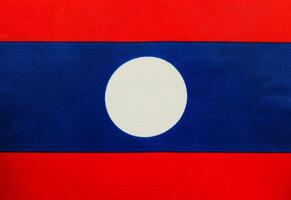 National flag of Laos displayed with vibrant colors photo
