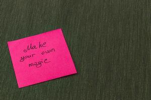 Create your own inspiration with a colorful sticky note on a warm backdrop photo