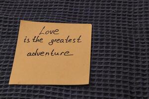 Note expressing the sentiment of love as an adventurous journey photo