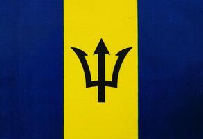 Barbados flag displaying vibrant colors and symbols photo